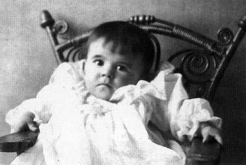 Powell as an infant.